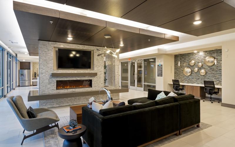 a clubhouse room with a fireplace