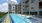 a swimming pool next to a building