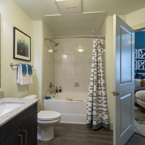 a bathroom with a tub sink and toilet