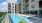 a swimming pool next to a building