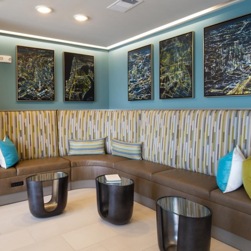 a room with a couch and tables