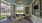 a clubhouse room with a chandelier and a couch