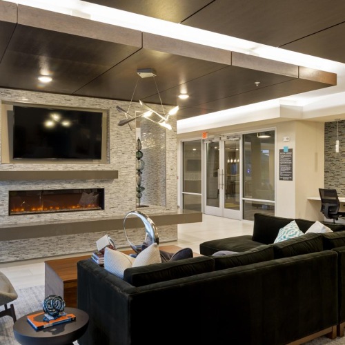 a clubhouse room with a fireplace