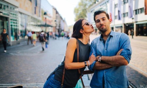 The essence of exceptional living a man and woman posing for a picture on a street