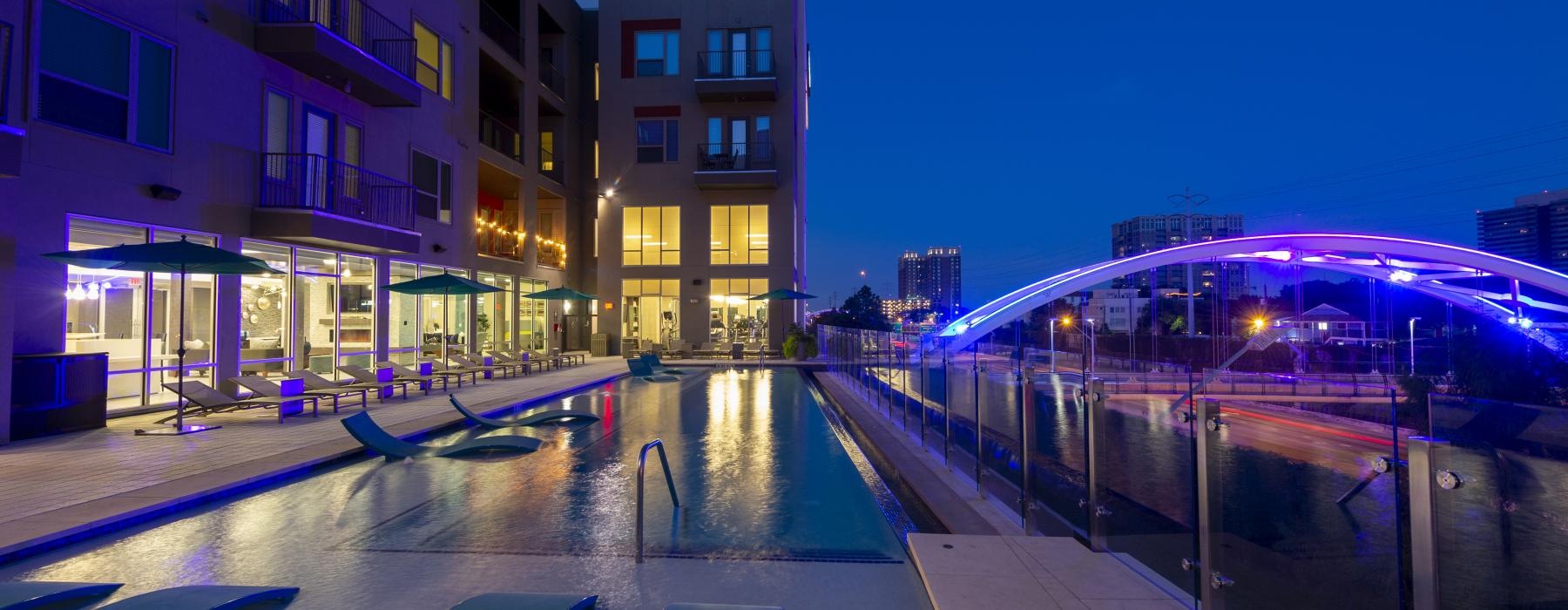 a pool in a courtyard at night