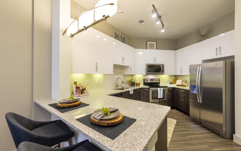 a kitchen with a table and chairs